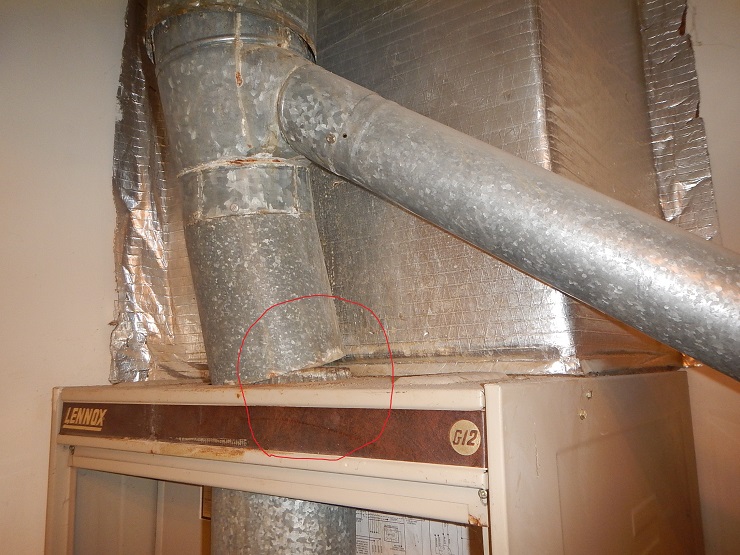 furnace flue that is leaking carbon monoxide into the home seen by home inspector in evansville indiana