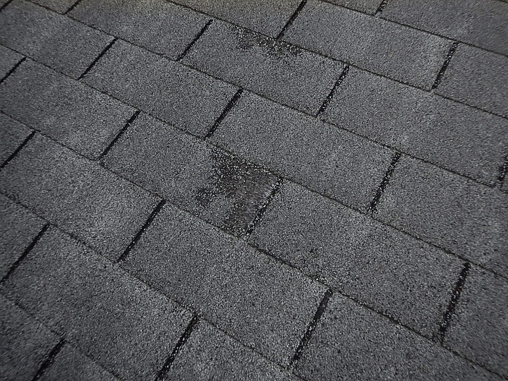 Scuffed shingles found on a roof by the home inspector near evansville indiana